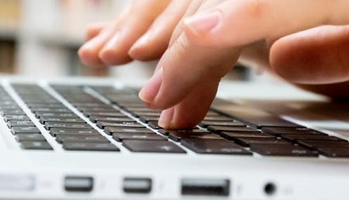 human finger on a keyboard
